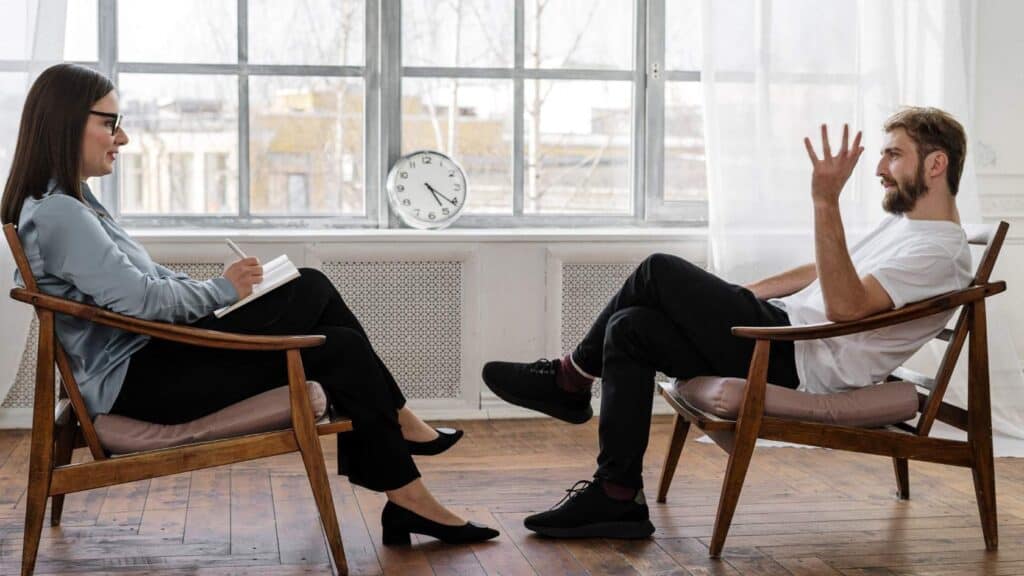 Man in a one-on-one session with a psychologist during holistic therapy in New Jersey.