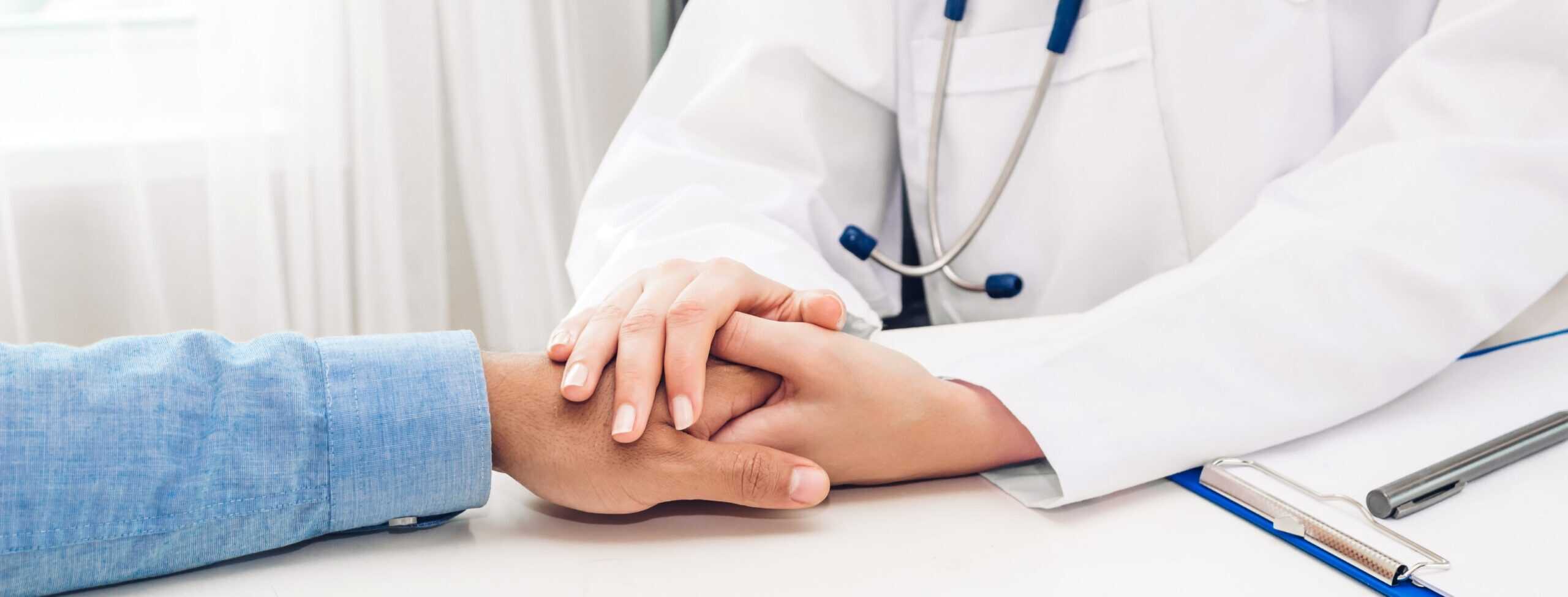 A man is comforted by his doctor during cocaine detox in New Jersey.