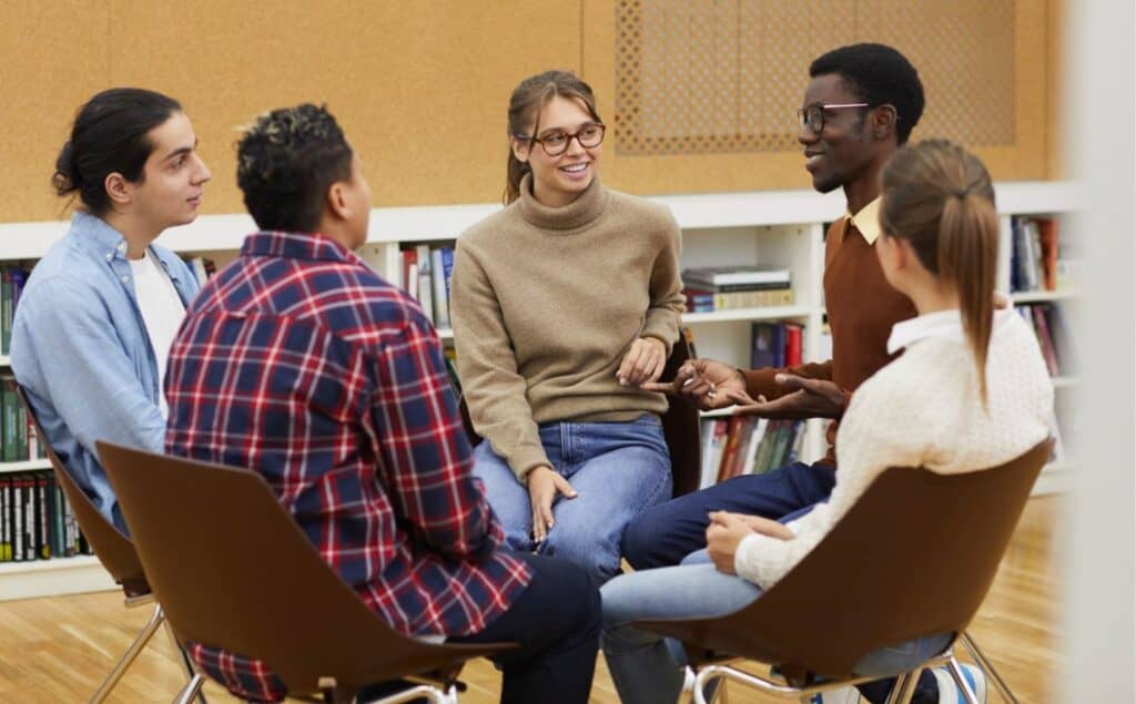 Young adults connecting in group therapy after detox for college students in New Jersey.