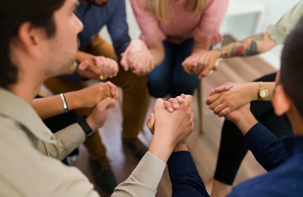 People share their experience during group therapy aftercare after completing detox.