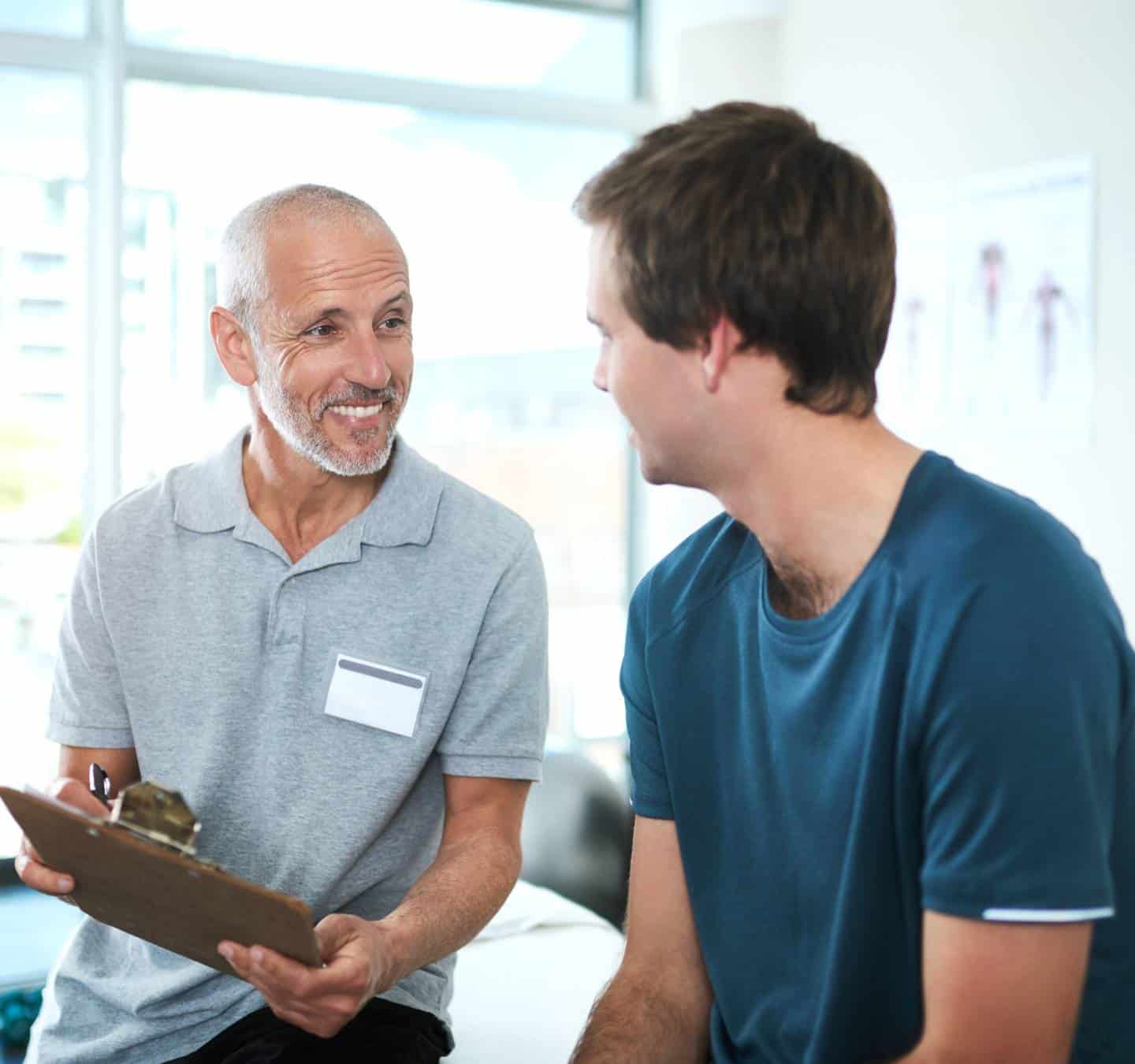 Professional checking on a client during medical detox.