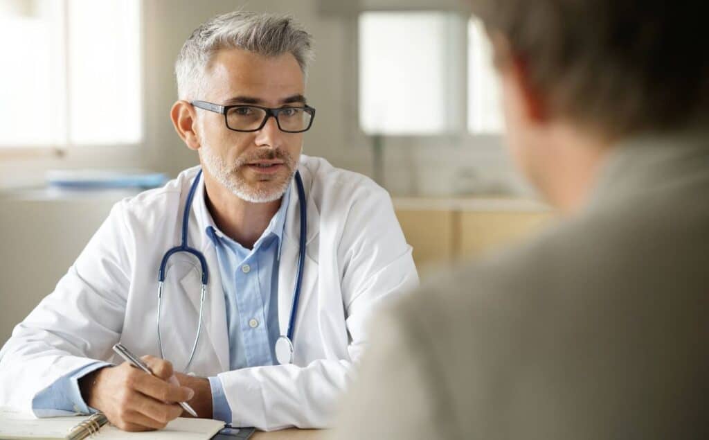 Physician meeting with patient for synthetic drug addiction treatment.