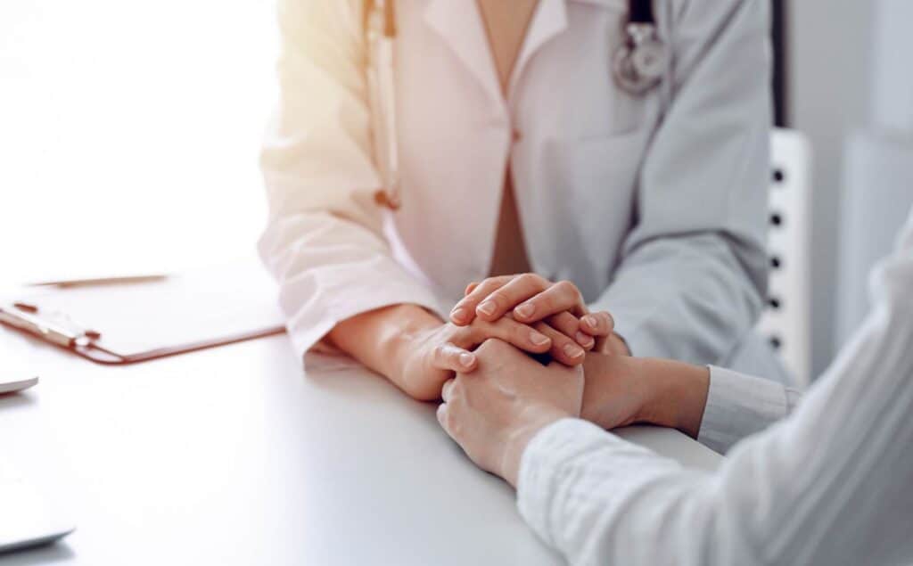 Doctor offering reassurance to a woman at our drug rehab near Vineland, NJ.