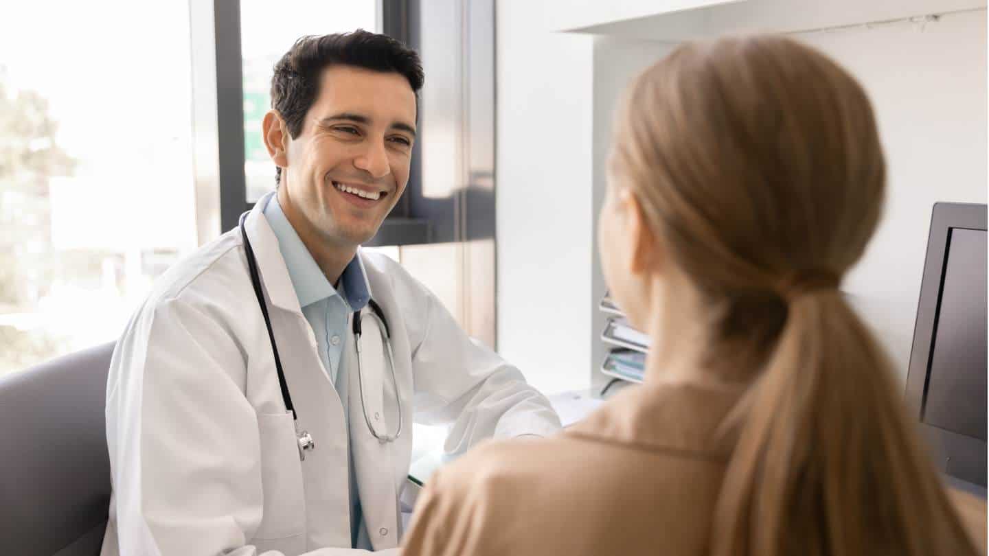 A doctor and patient in a focused conversation during PCP detox in New Jersey.